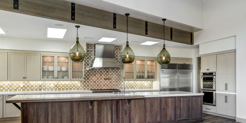 kitchen with large pendant lights over island