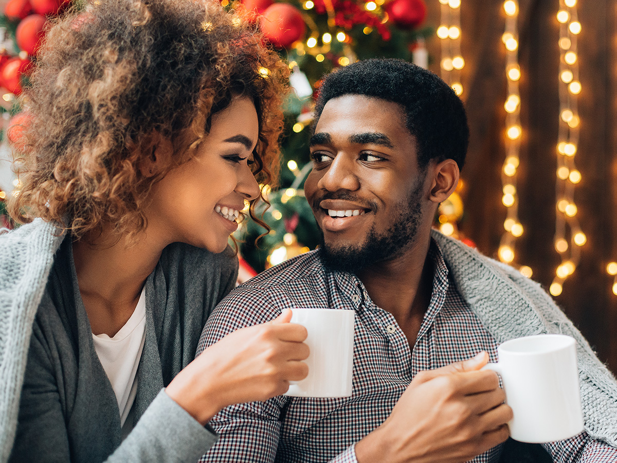 image of a couple enjoying a christmas tree