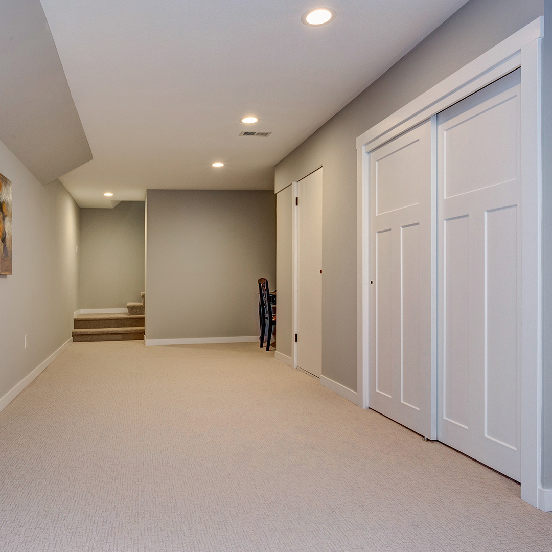 recessed lighting in a basement hallway