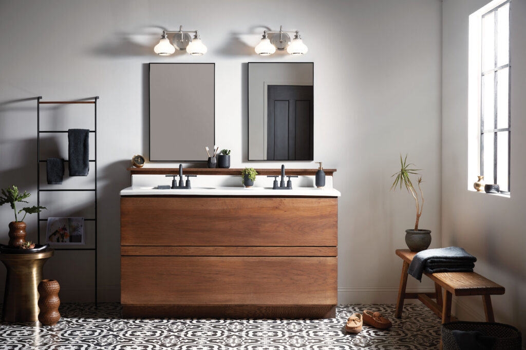 a modern bathroom with a two sink vanity in front of two rectangular mirrors and lighting above them