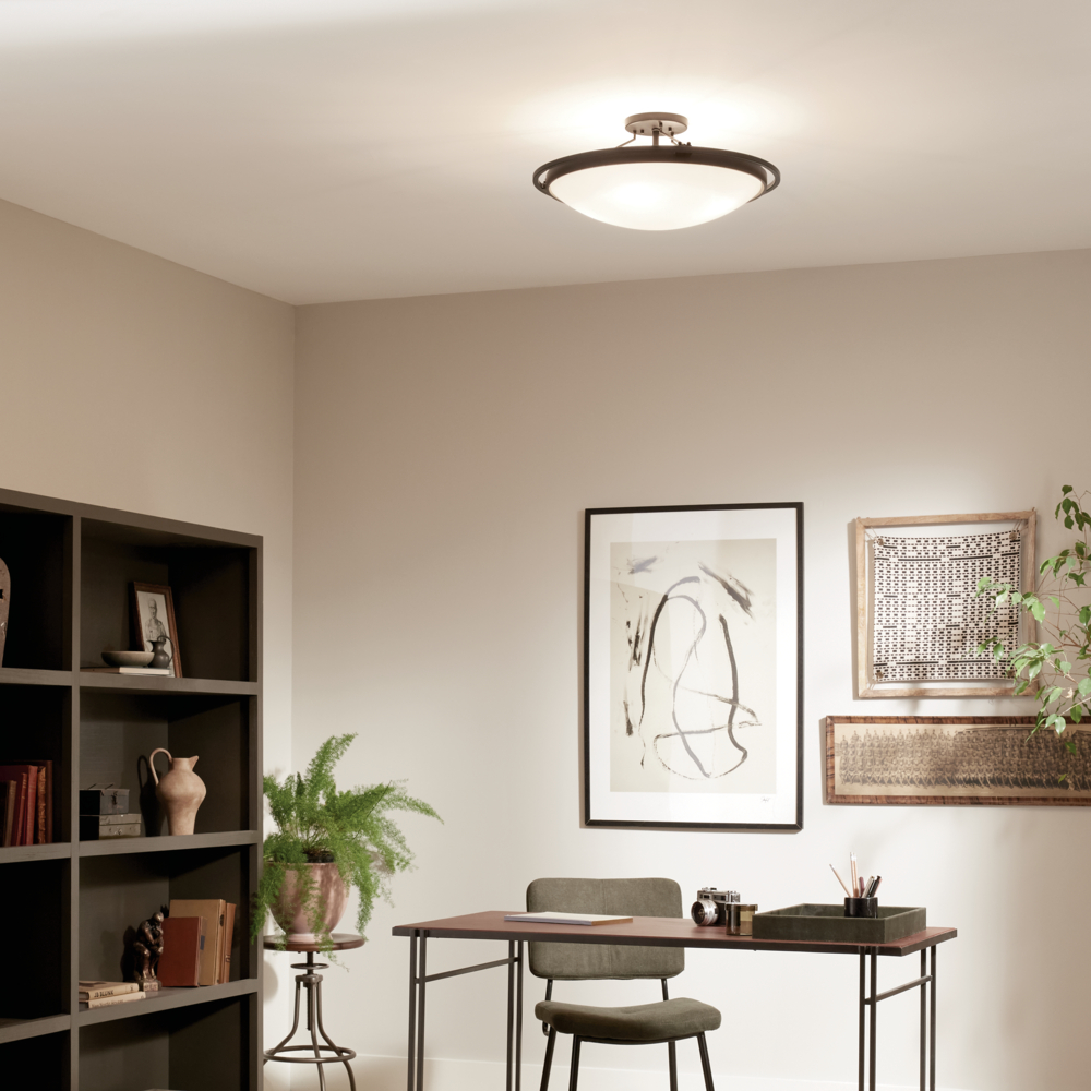 ceiling light casting effective lighting onto a desk working area