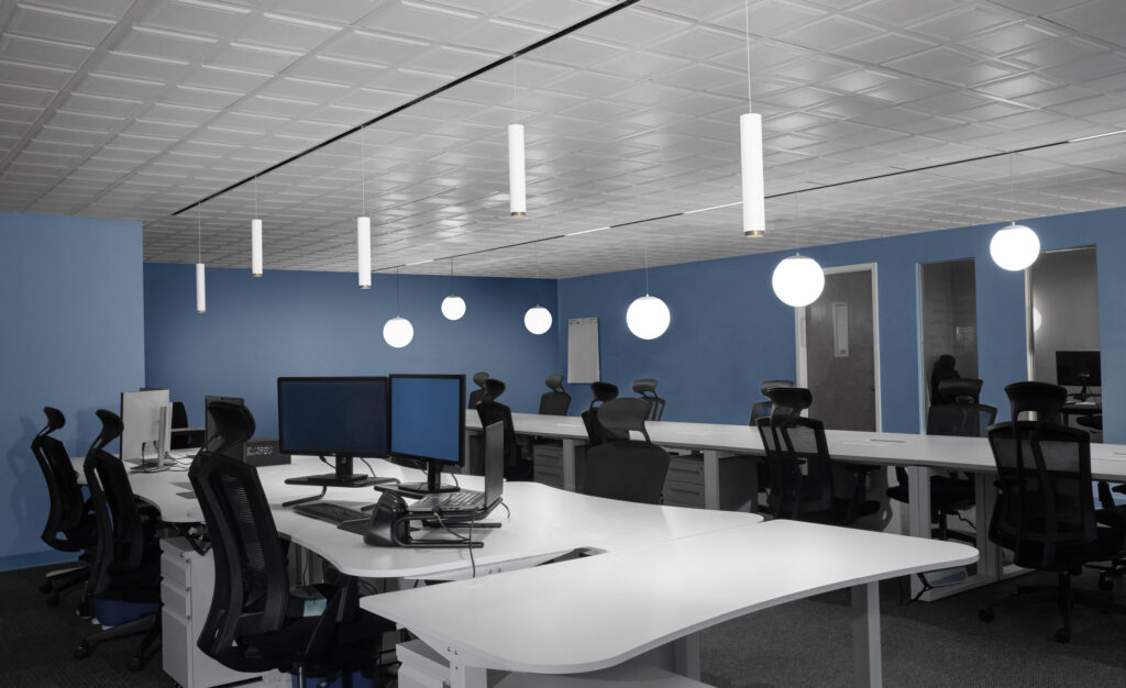 hanging bulb lights in a conference room with blue walls
